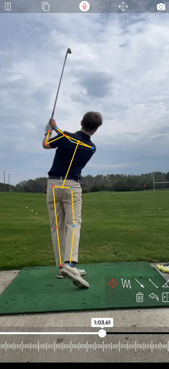 Skillest analysis view with the automatic pose skeleton overlaid on a golfer at the top of the backswing