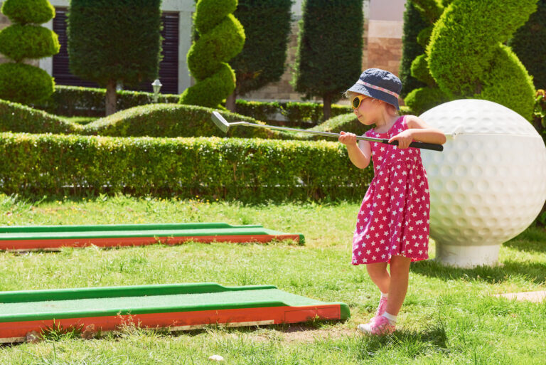 Child Playing Mini Golf Artificial Grass 768x513 