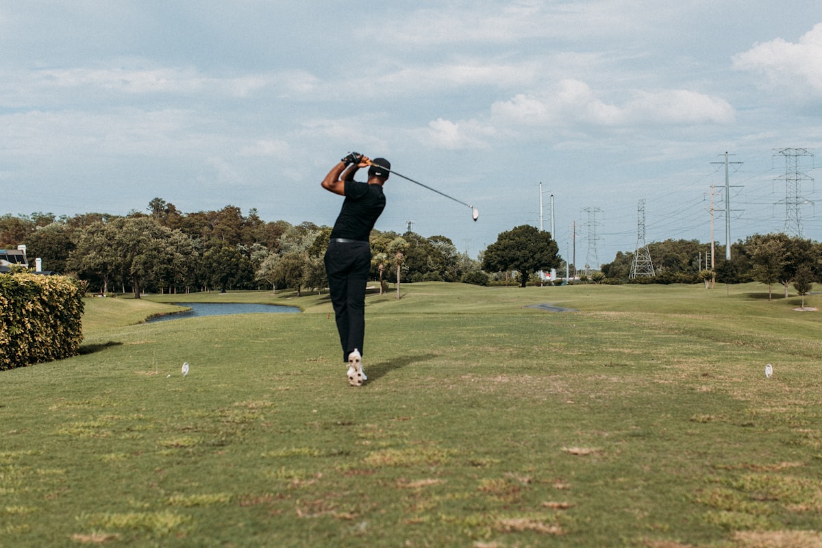 Golfer setting up to hit a driver on the tee