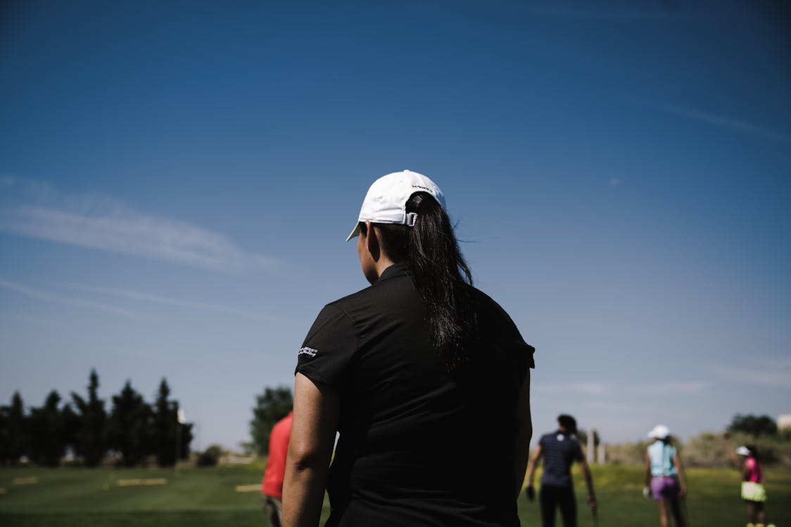 Golfer hitting powerful drive on the course