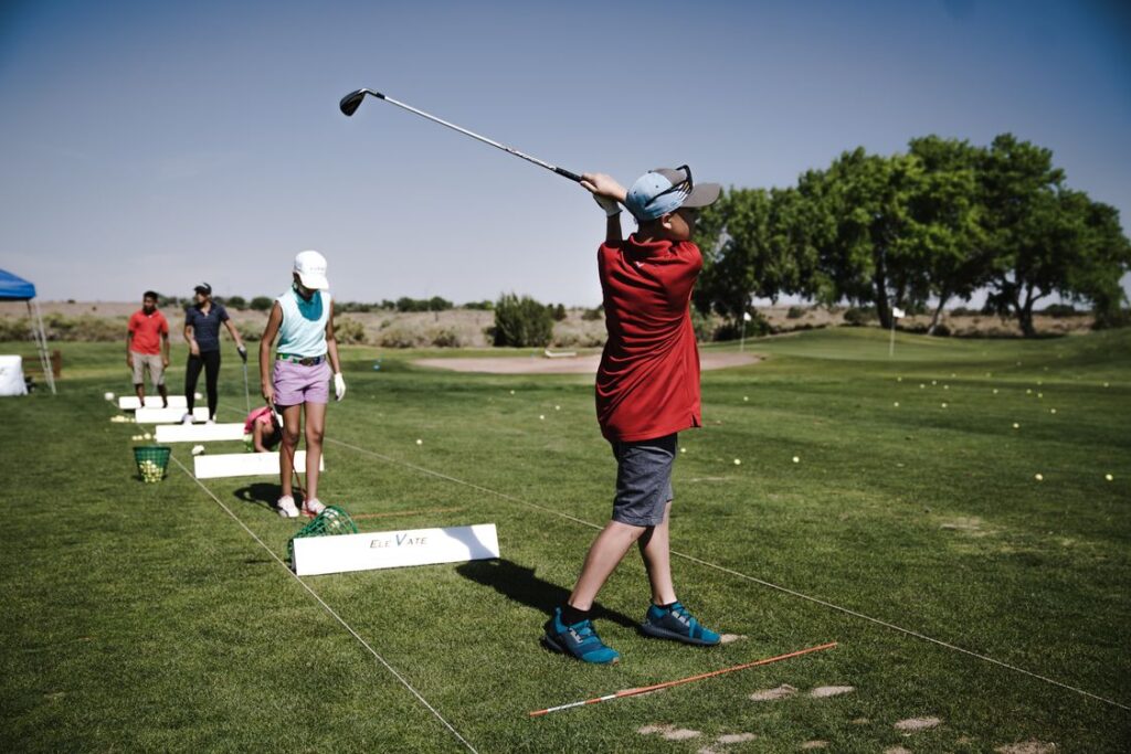 Golfer practicing swing on the fairway